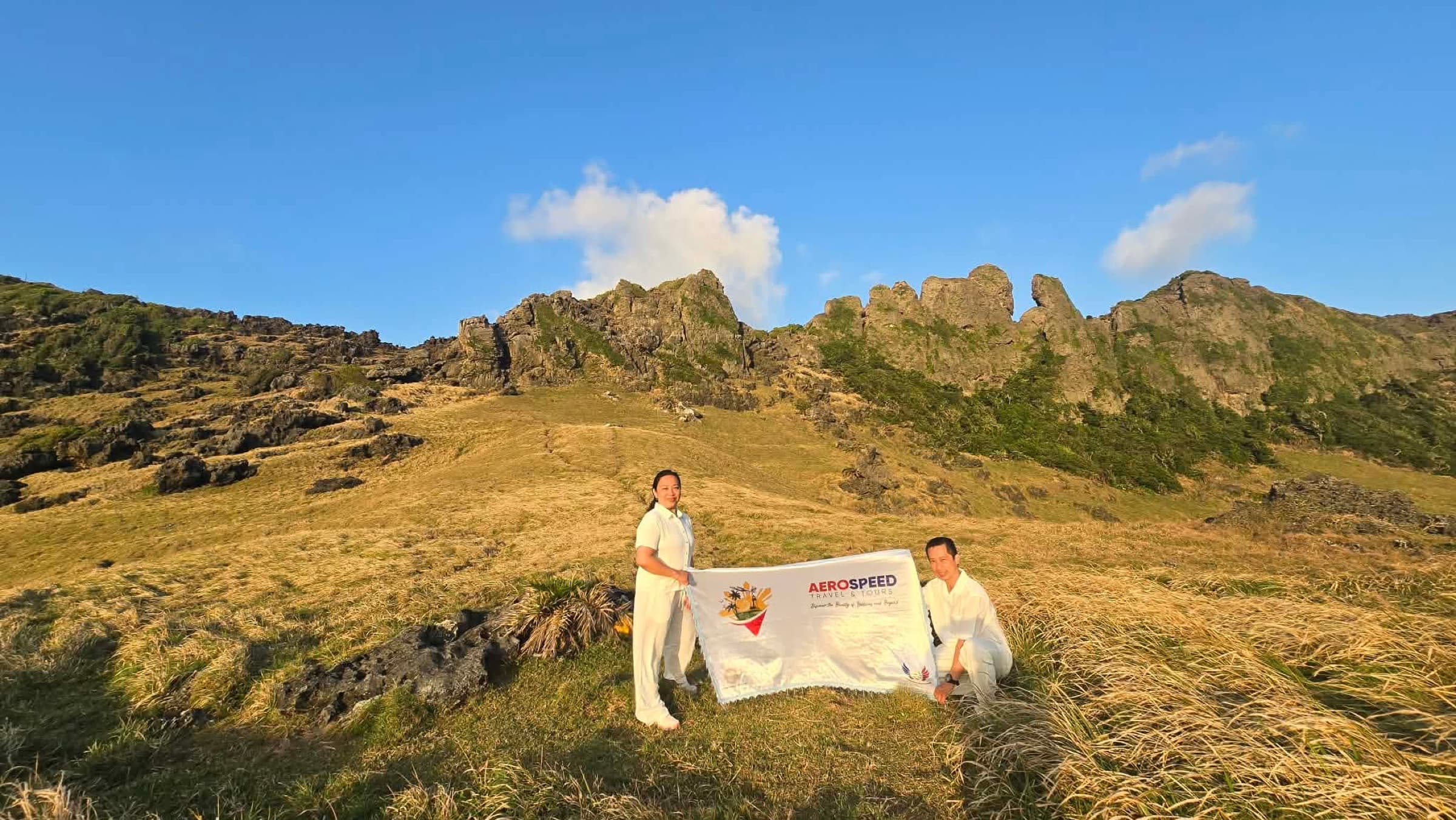 AeroSpeed travelers holding the company banner in Itbayat