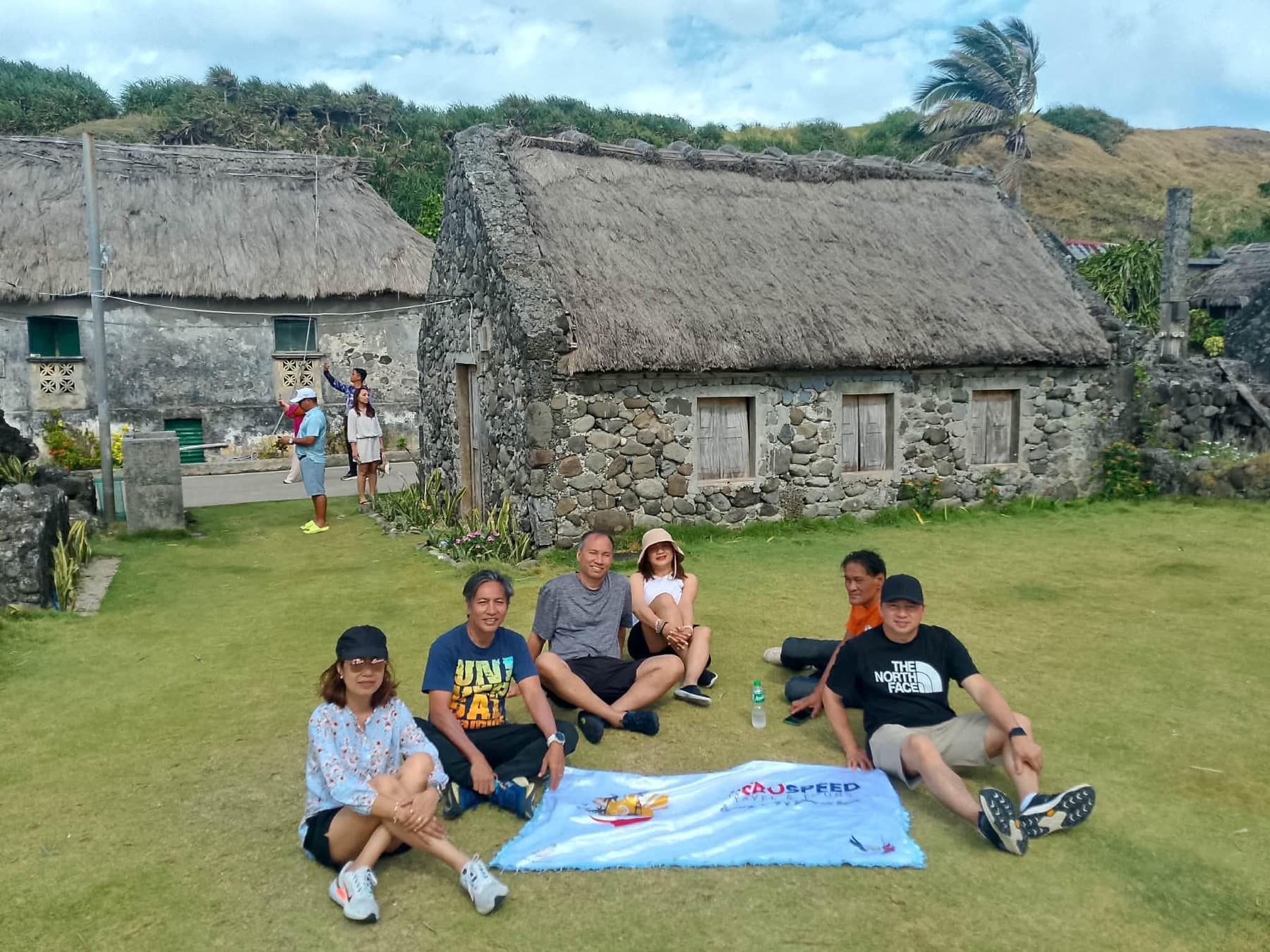 Travelers exploring a Sabtang village